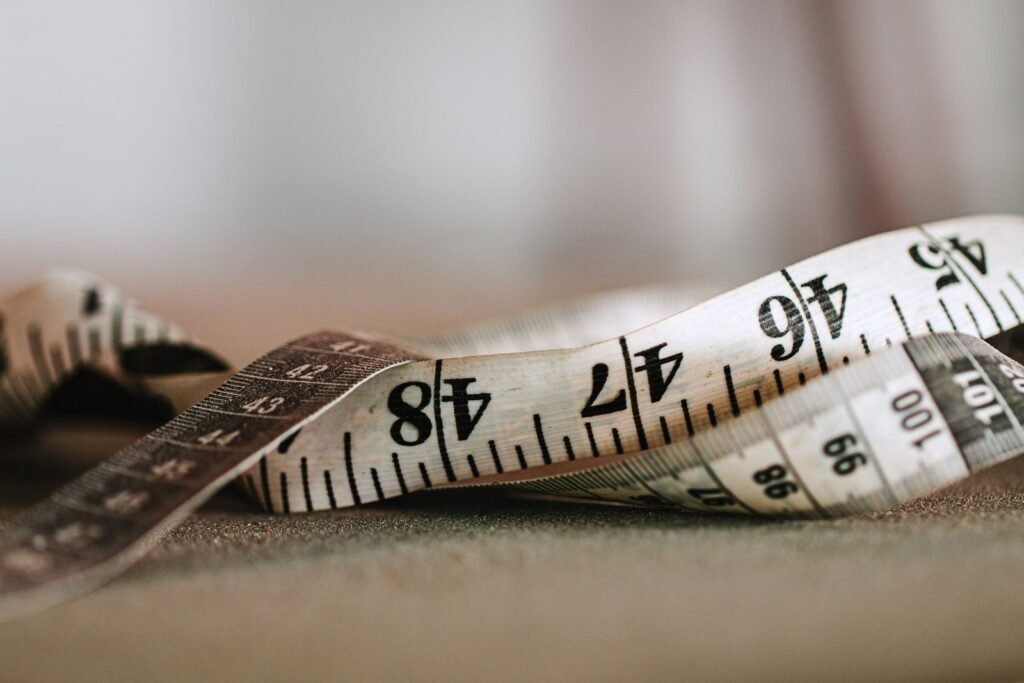 Close-up of a tape measure, illustrating reliable ways to track FUPA progress over time