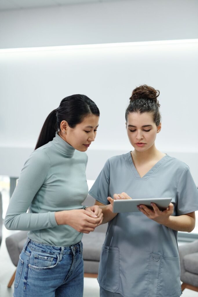 Doctor and patient reviewing results on a tablet, illustrating the FUPA surgery before and after guide