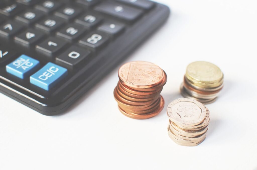 Calculator and coins, illustrating the FUPA surgery cost guide