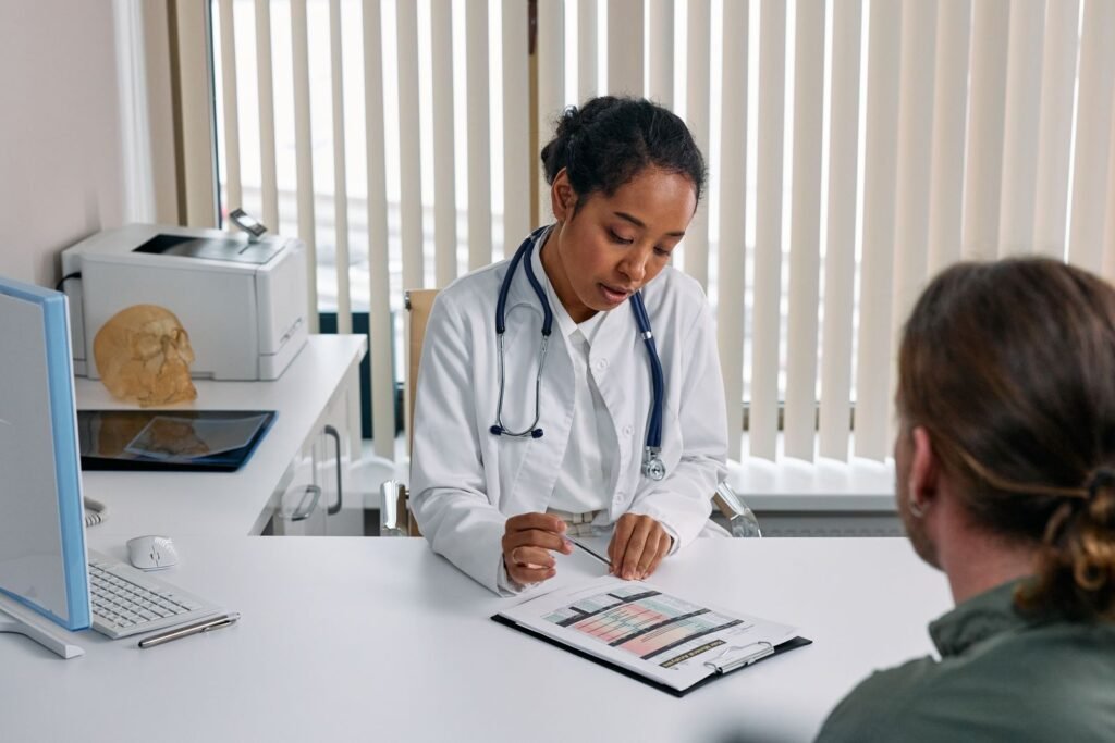 Doctor consulting with a patient about liposuction, illustrating the FUPA liposuction guide
