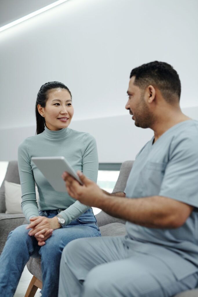 Healthcare professional discussing non-surgical fat reduction options with a patient