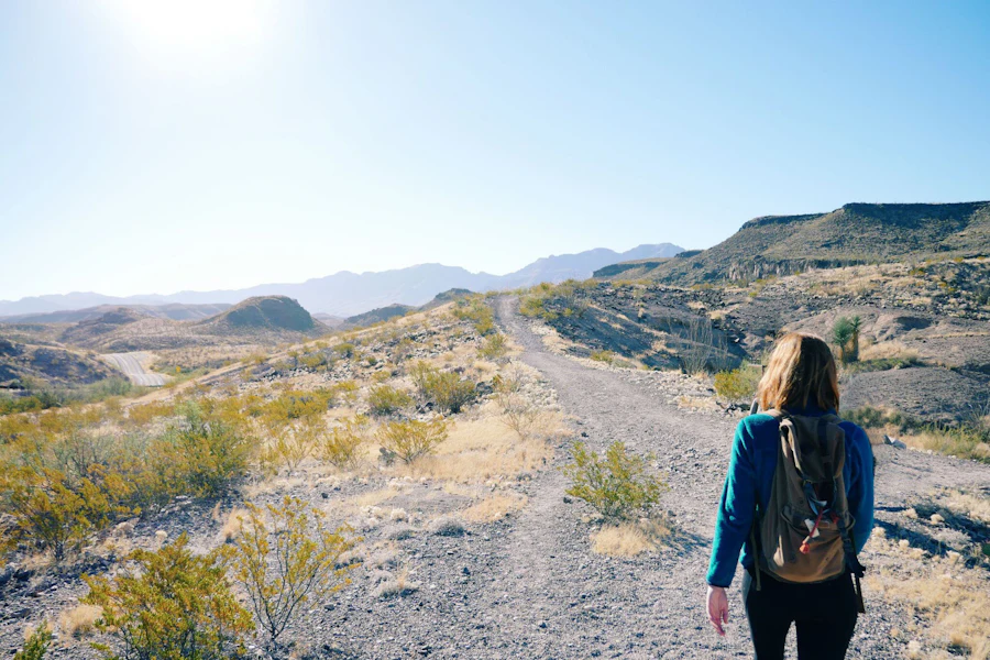 Woman walking along an outdoor trail as moderate intensity activity for fat loss