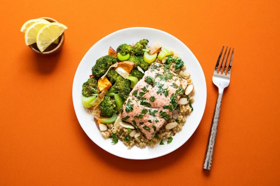 Salmon fillet on quinoa with roasted broccoli as a high protein meal for a calorie deficit