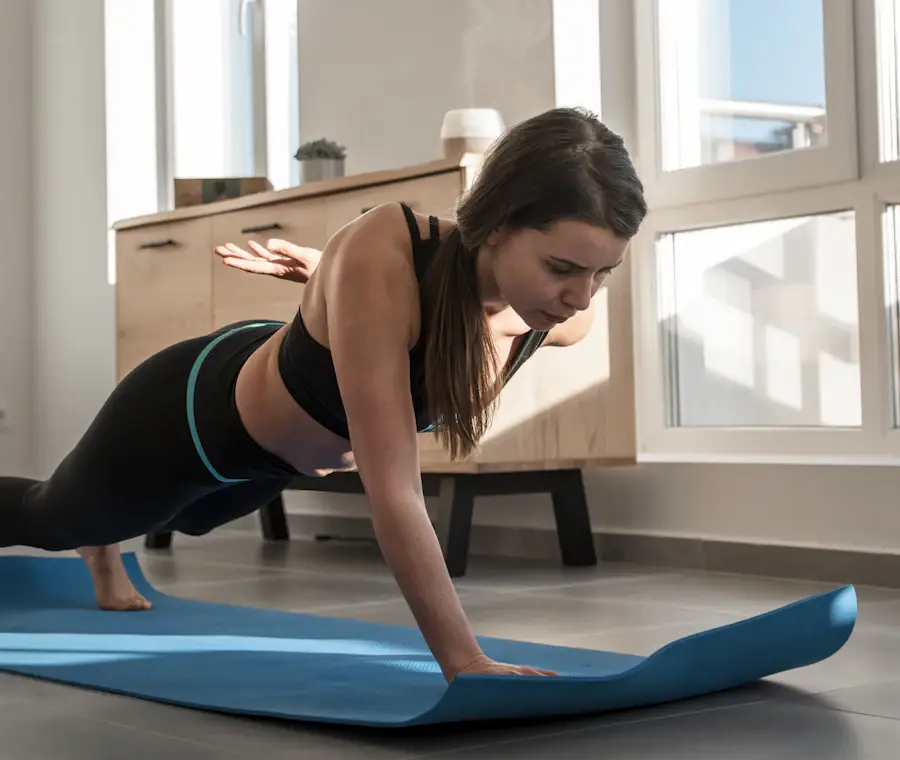 Woman holding a high plank on a yoga mat as part of a lower belly core routine