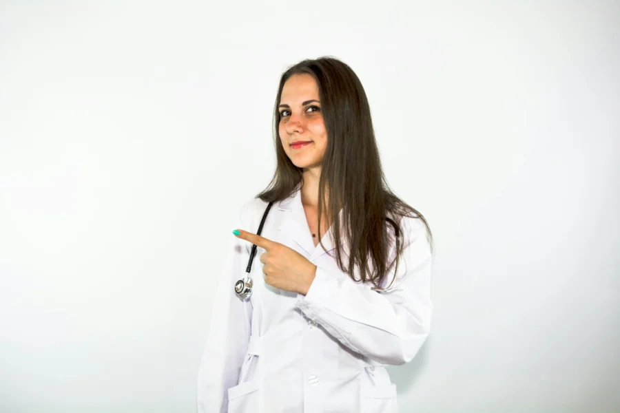 Doctor in a white coat giving advice in a clinic about weight loss and lower belly concerns